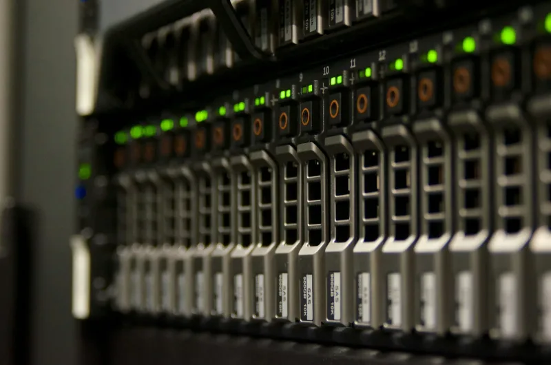A server rack with blinking green status lights