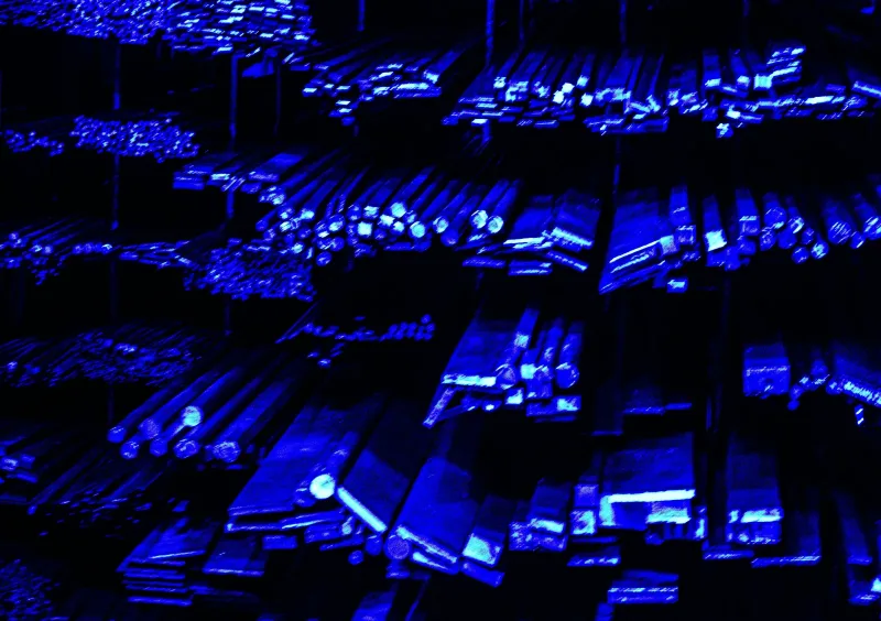 Rows of blue-lit server hardware in a dark data center
