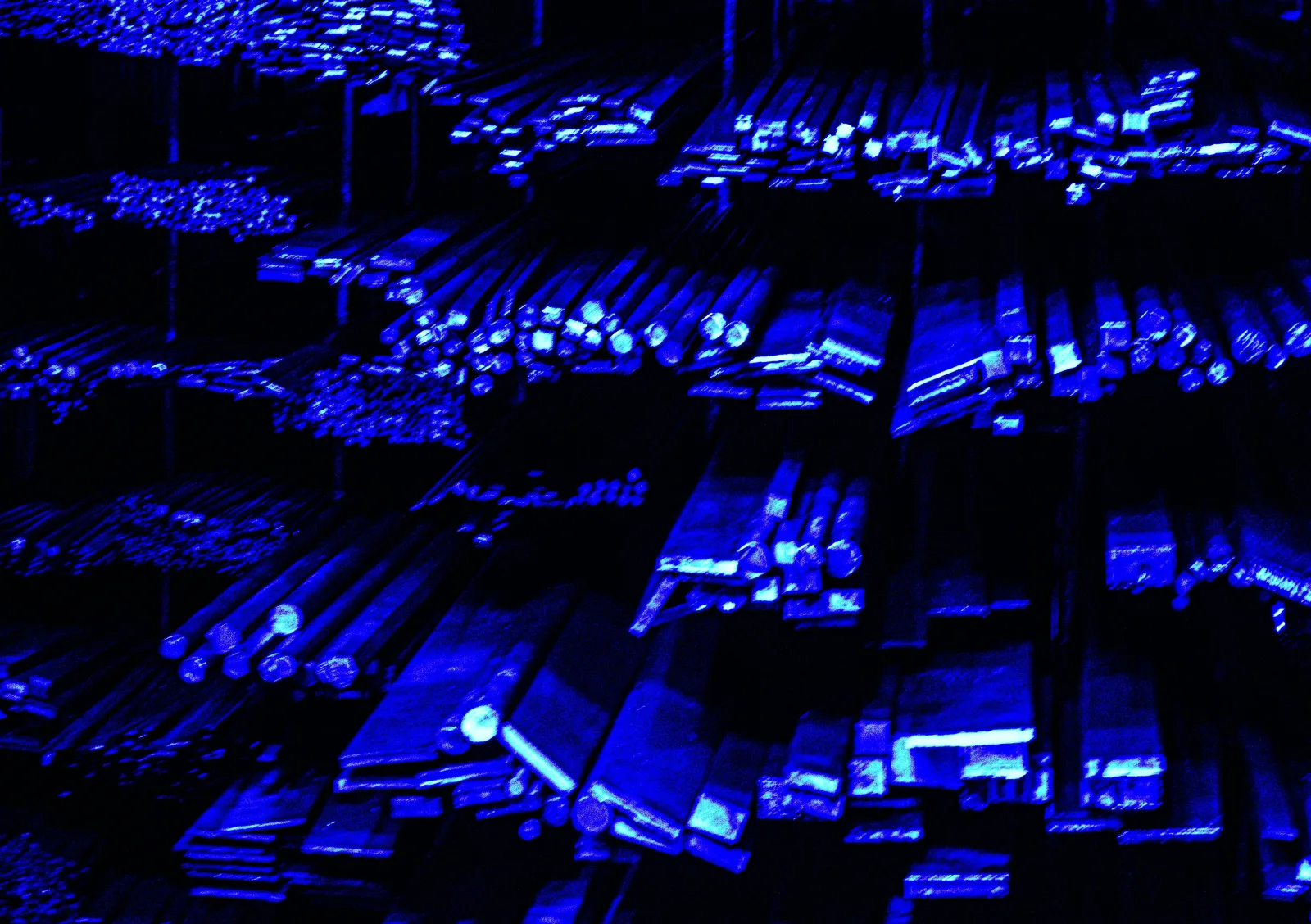 Rows of blue-lit server hardware in a dark data center